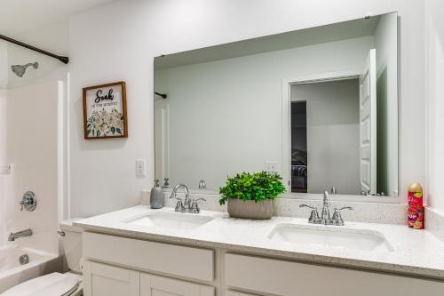 a bathroom with two sinks and a large mirror at Quiet Avon Home - Near Indianapolis Speedway! in Avon