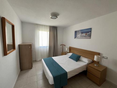 Un pat sau paturi într-o cameră la Kione Sol y Mar