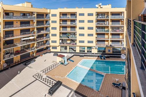 an overhead view of an apartment building with a swimming pool at Mar & Serra in Armação de Pêra