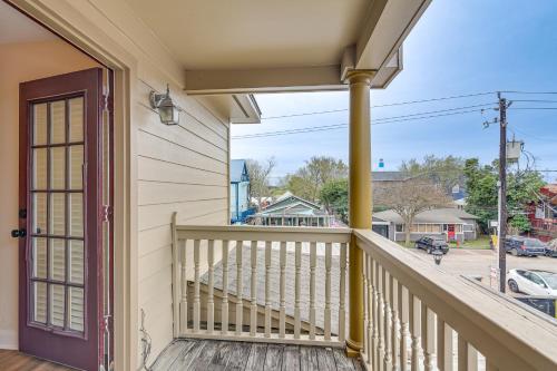 a balcony with a door and a view of a street at Downtown Kemah Rental about 3 Blocks to Boardwalk! in Kemah
