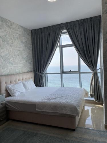 Cama o camas de una habitación en Ocean View Luxury Suites
