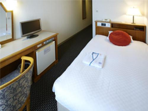 Postelja oz. postelje v sobi nastanitve Pearl Hotel Mizonokuchi