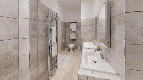 a bathroom with a sink and a toilet at Owston Hall Hotel in Doncaster