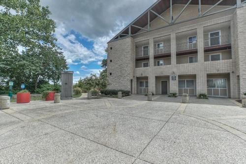 an empty parking lot in front of a building at Walk to Broadway Riverfront Condo with Pool in Nashville