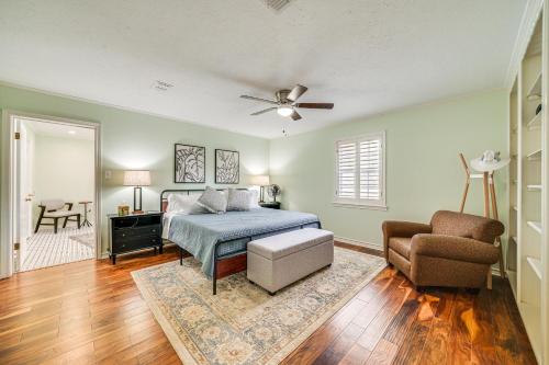 a bedroom with a bed and a couch and a chair at Expansive Texarkana Home with Yard Near Golf! in Texarkana