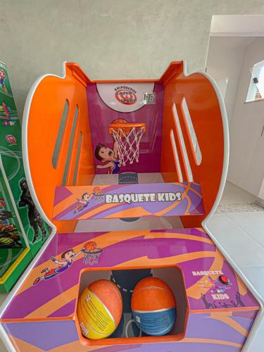 a dunkin donuts basketball hoop with balls in it at Principe do Mutá Hotel Design in Santa Cruz Cabrália