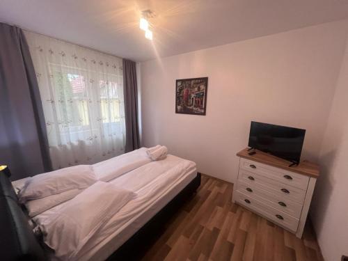 Ένα ή περισσότερα κρεβάτια σε δωμάτιο στο Helix Apartaments