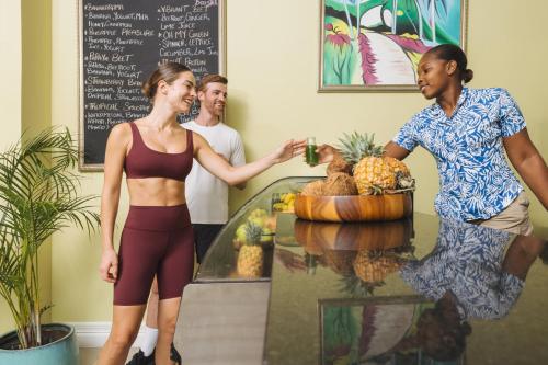 a woman standing in front of a fruit stand at Jewel Grande Montego Bay Resort and Spa in Montego Bay