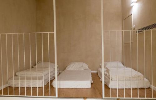 Un ou plusieurs lits dans un hébergement de l'établissement Hagafen Boutique Suites