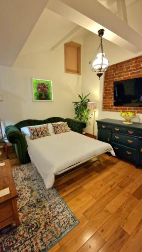 a bedroom with a bed in a room at The Three Musketeers, Aramis in Eastbourne