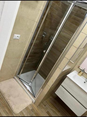 a glass shower in a bathroom with a sink at Casa Marisa Pozzuoli in Pozzuoli