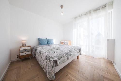 En eller flere senge i et værelse på Élégance et confort- Vidéoprojecteur Tours-Parking