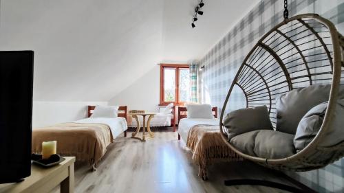 Ένα ή περισσότερα κρεβάτια σε δωμάτιο στο Apartament Pod Lipami