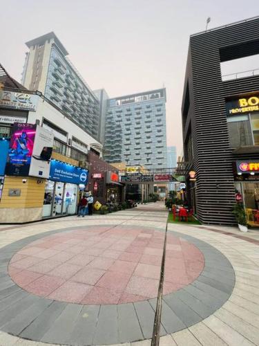 a street in a city with tall buildings at Luxury Studios Key 10 in Gurgaon