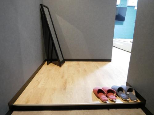 a row of pairs of shoes on a shelf at HOOD - Vacation STAY 19642v in Amami