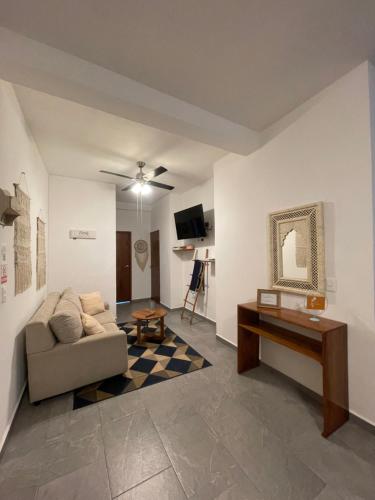 a living room with a couch and a table at Suites Maya Ka’an in Cancún