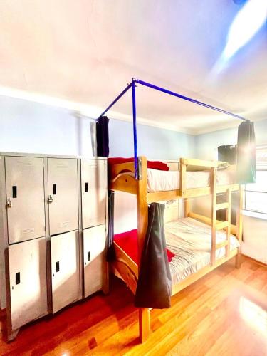 a room with two bunk beds and a slide at Cusco House Inn Hostel in Cusco