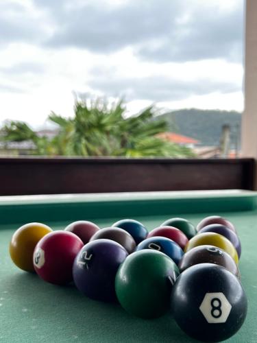 a group of billiard balls on a pool table at Pousada Casa Chico in Navegantes