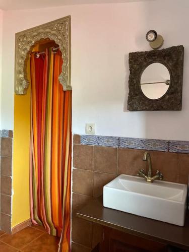 a bathroom with a sink and a mirror at Casa rural en El Burguillo - Picos Pardos CRA-AV-1088 in El Barraco