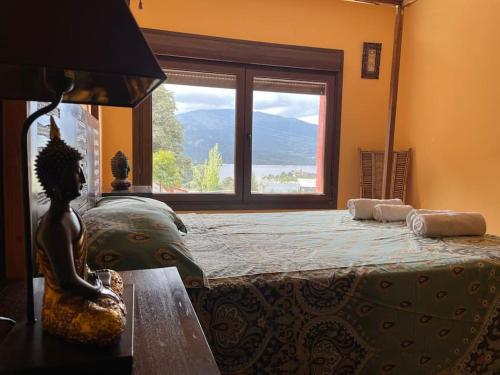 a bedroom with a large bed with a large window at Picos Pardos CRA-AV-1088 in El Barraco