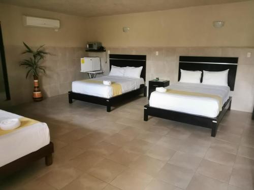 Una cama o camas en una habitación de Villas Bayal