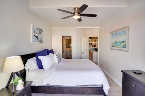 a bedroom with a bed with a ceiling fan at Gorgeous Catalina Island Condo with Golf Cart! in Avalon