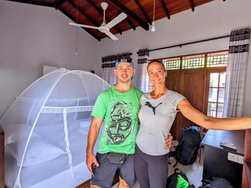 two men standing in a room with a tent at Lavish Lodge, Tangalle, Sri Lanka in Tangalle