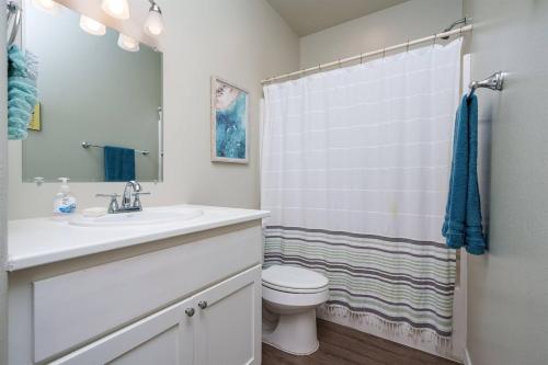 a bathroom with a sink and a toilet at The Yellow Getaway - Community Pool in Rockport