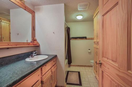 a bathroom with a sink and a mirror at Rustling Wind Haven in Lead