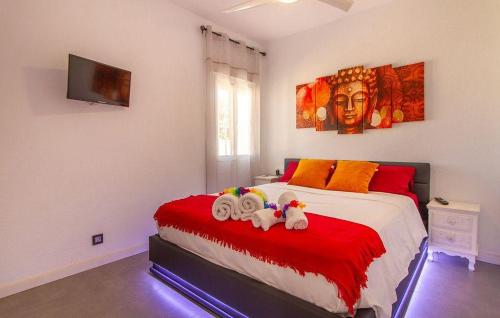 a bedroom with a bed with two stuffed animals on it at Casa con acceso directo a la playa de Mojácar in Mojácar