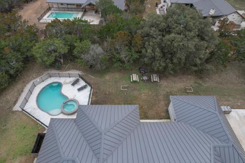 an aerial view of a backyard with a swimming pool at Driftwood in Concan