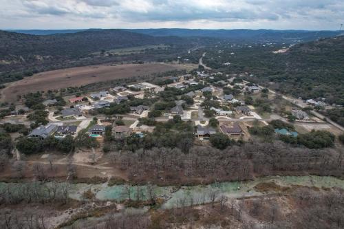 an aerial view of a subdivision of houses at Driftwood in Concan