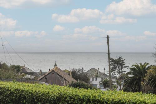 a view of the ocean from a town at Rock Pool in Downderry