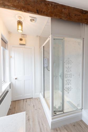 a room with a glass door and a window at Prospect House in Whitby