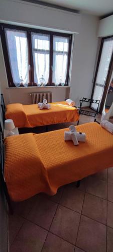 Postel nebo postele na pokoji v ubytování L'ORCHIDHEA APARTMENT