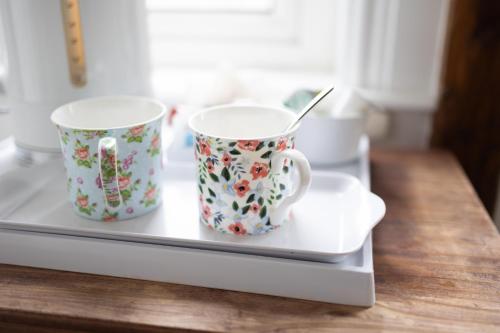 two coffee mugs sitting on a tray on a counter at Prospect House in Whitby