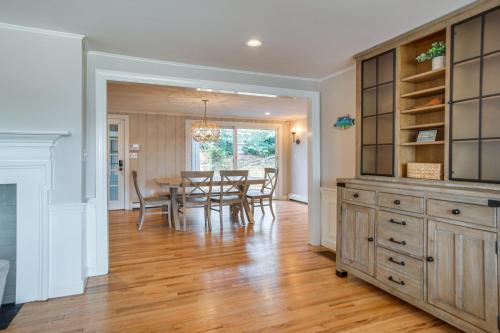 a dining room and kitchen with a table and chairs at 1 Mi to Beach Cape Cod Family Home in Bourne! in Bourne