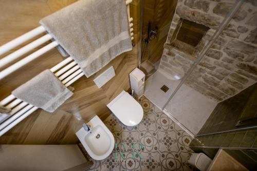 an overhead view of a bathroom with a shower and a toilet at Rosa Rooms - Living & Relax - Family House in Bisceglie