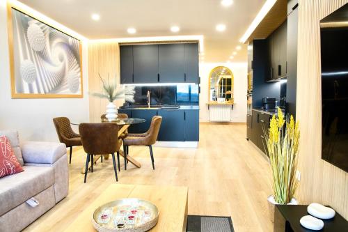 a living room and kitchen with a couch and a table at Lucus Skyline & Terrace by Lugo Collection in Lugo