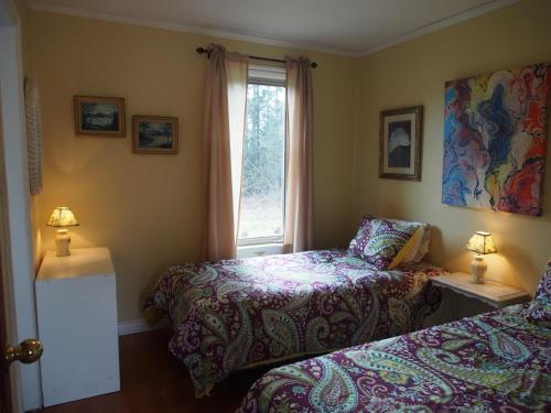 Postel nebo postele na pokoji v ubytování Woodside Inn