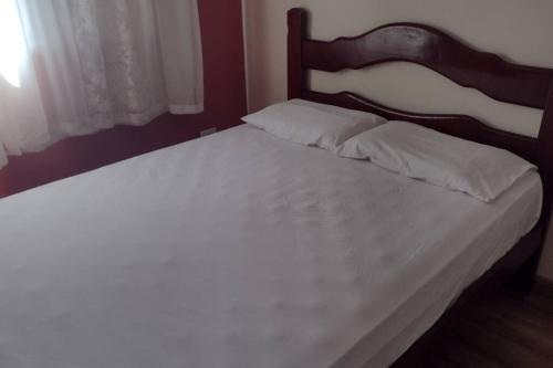 Кровать или кровати в номере Apartamento prático, simples CDHU.