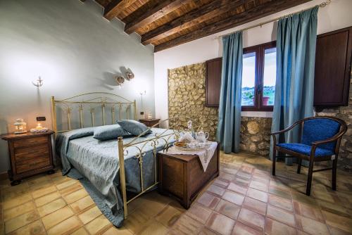 Ένα ή περισσότερα κρεβάτια σε δωμάτιο στο Agriturismo Baglio del Melograno
