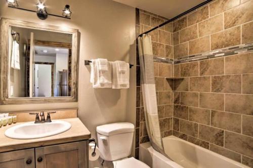 a bathroom with a sink and a tub and a toilet at Angel Rock Rentals of Moab Unit 2 in Moab