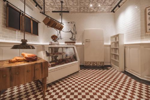 a kitchen with a refrigerator and a counter with bread at Hyatt Zilara Cap Cana - Adults Only in Punta Cana