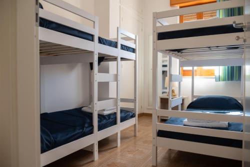 a bunk bed room with two bunk beds at La perla sulla spiaggia in Alcamo Marina