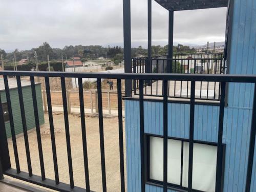 a view from a balcony of a blue building at Twin Brothers Pichidangui 1 in Pichidangui