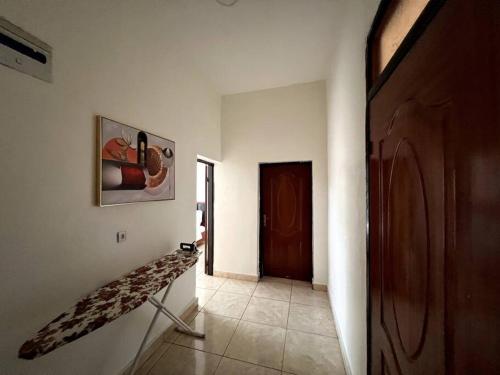 a hallway with a stair case in a house at Alma Residence Apartment in Rubavu