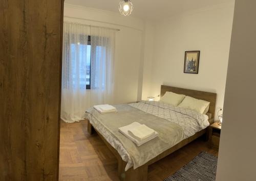 Llit o llits en una habitació de Simplicity Center Apartment