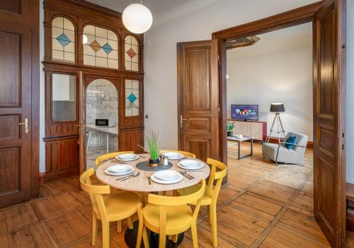a dining room with a table and chairs at Art House Apartments by Adrez in Prague
