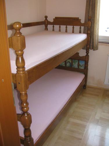 a couple of bunk beds in a room at Apartment Megi in Tribunj